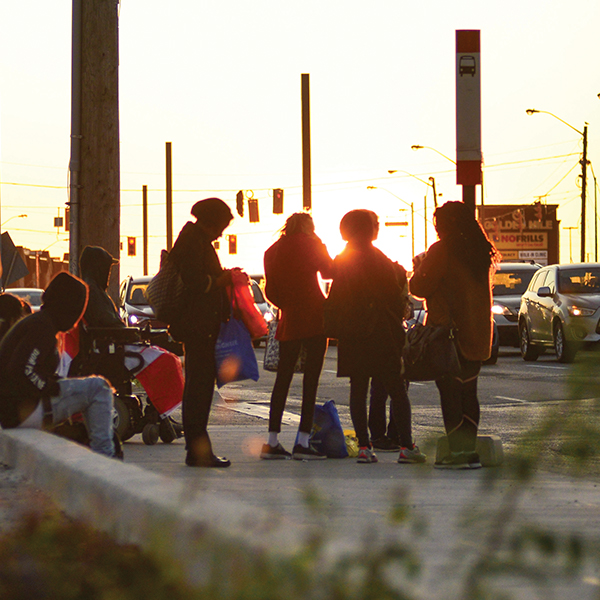 Image of people waiting at a bus stop in Scarborough